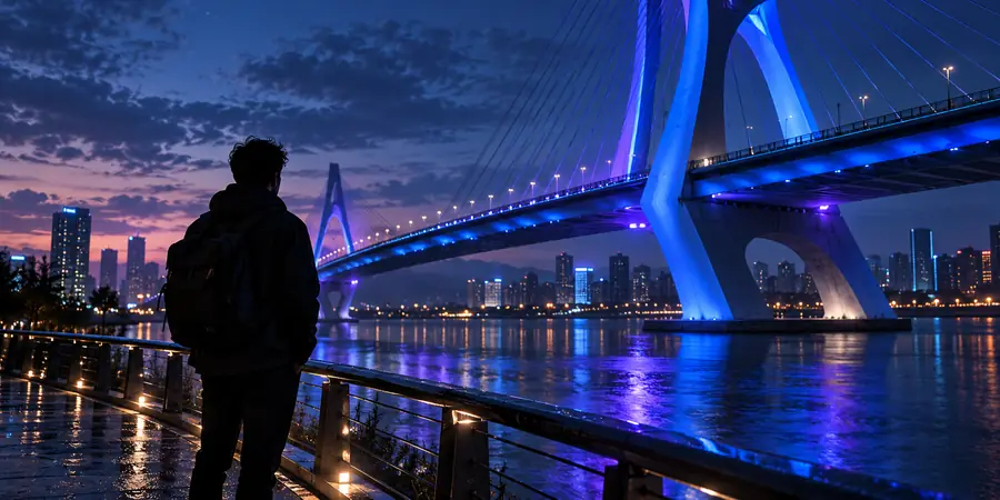 Illustrative source photograph of a person beside a bridge